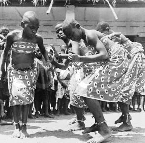 Original caption: Okporo, Nigeria: Return To Normal Dancing is children's spontaneous way of expressing well being and general enthusiasm at a near return to normal family and community living following the Nigerian civil war. August 17, 1970 Okporo, Nigeria